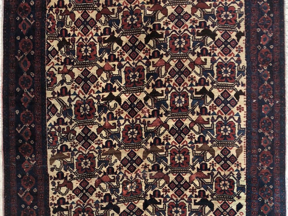 Antique Afshar rug showing the softened colour of natural dyes